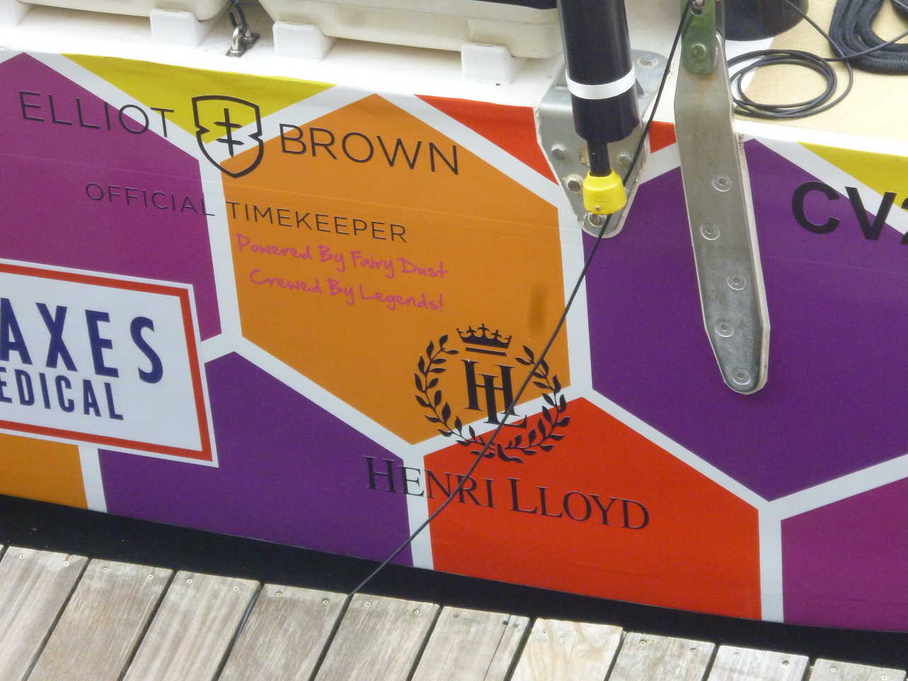 Caption on stern of boat, together with sponsor logos